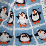Plaid avec des pingouins à partir de fragments tricotés séparés