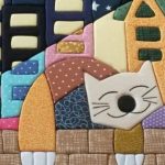 Couverture avec un chat dans la technique du patchwork